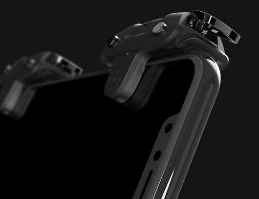 Black F5 game controller for mobile phones with two silver trigger buttons and a green indicator light. - Image 12