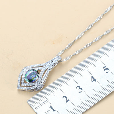 4-piece women's jewelry set with silver-tone necklace, ring, earrings, and bracelet, featuring red oval gemstones surrounded by clear accent stones. - Image 3