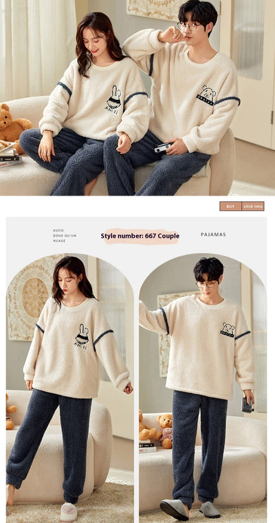 Couple wearing matching cream coral fleece pajamas with gray pants and bear embroidery, seated on a bed. - Image 22