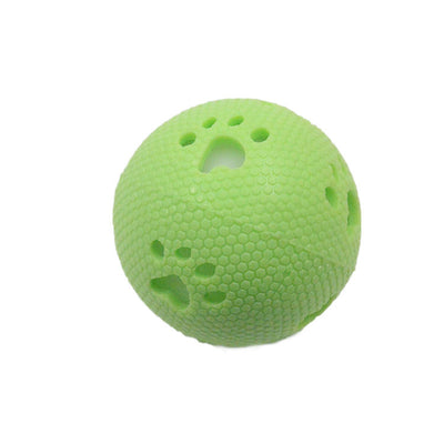 Green TPR hollow pet ball with honeycomb texture and paw print cutouts, designed for play. - Image 4