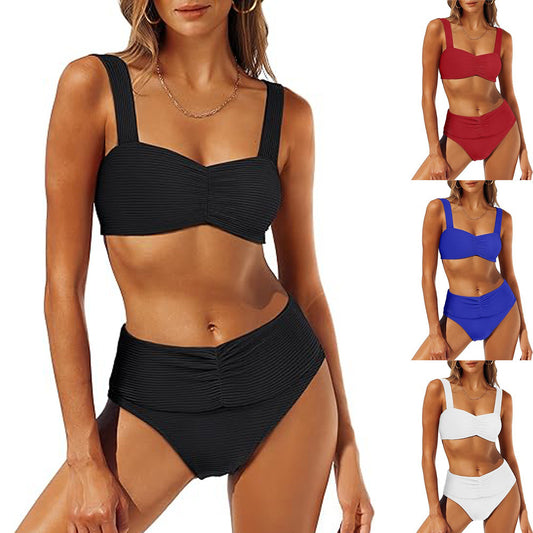 White pleated bikini with wide shoulder straps and high-waisted ruched bottom on a model.