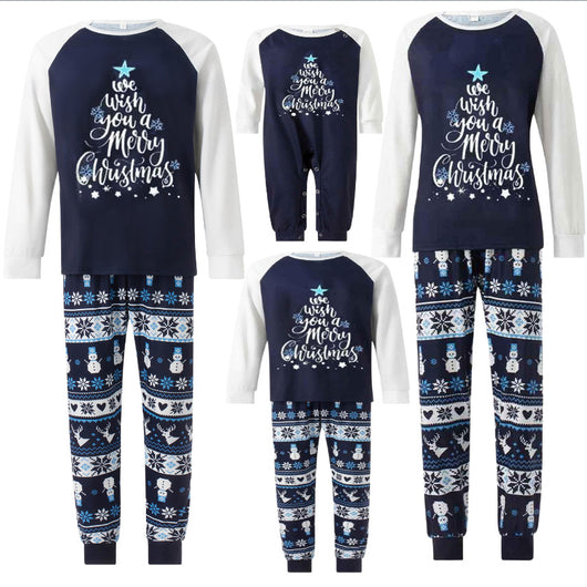 Matching family pajamas with navy blue and white raglan tops featuring a 'Let it Snow' graphic and snowman hat. Bottoms have a festive pattern of snowflakes, sn - Image 4