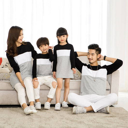 Matching black, white, and grey colorblock long-sleeved t-shirts for couples, worn by a man and a woman. - Image 3