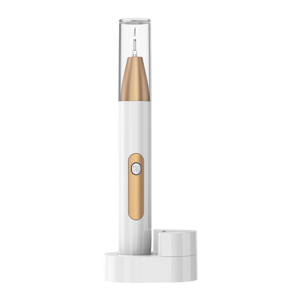 White and gold ultrasonic tooth cleaner with a pointed metal tip, standing in a white charging base.