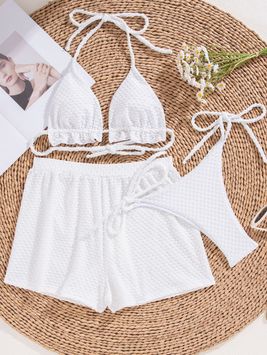 White polka dot three-piece swimsuit for women, featuring a halter bikini top with ruffled trim and matching high-waisted shorts. - Image 10