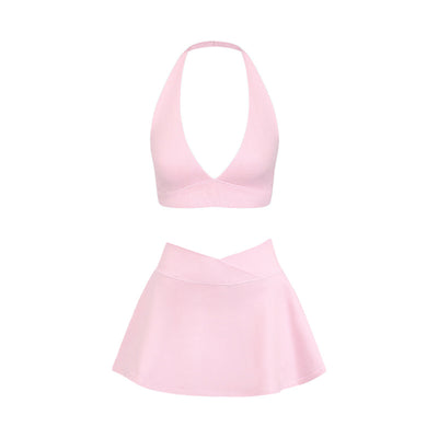 Light pink halter neck sports bra and high-waisted leggings workout set on a model. - Image 5