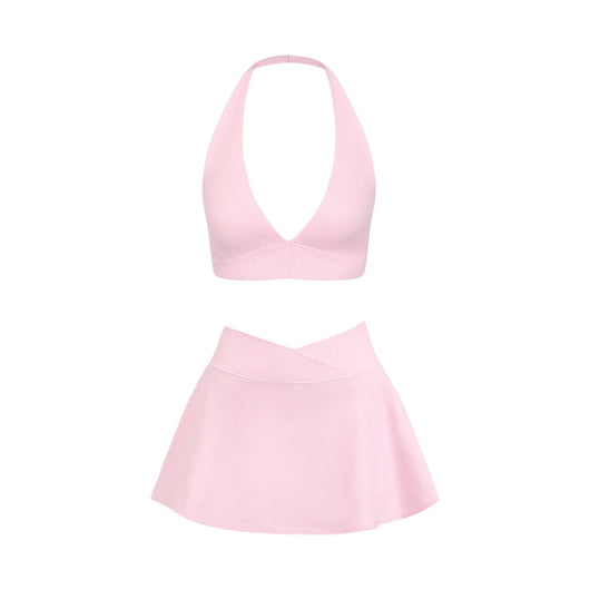 Light pink halter neck sports bra and high-waisted leggings workout set on a model. - Image 5