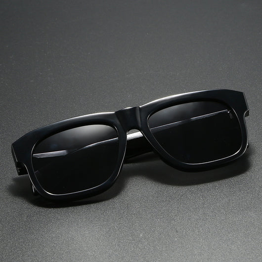 Black square-frame polarized sunglasses with dark lenses, suitable for both men and women, on a dark gray surface. - Image 9