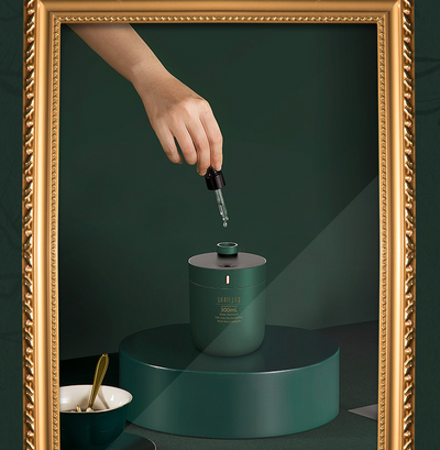 Dark green cylindrical humidifier with a black top, 300mL capacity, and a single control button. - Image 10