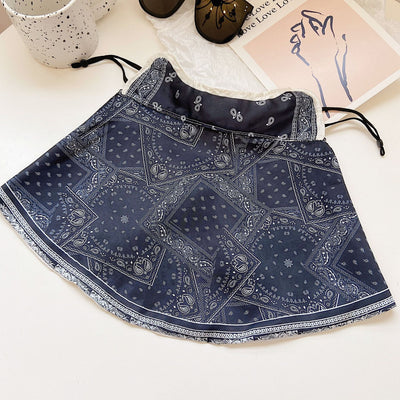 Female cream and black floral polka dot sun protection mask with ear loops, designed for eye corner protection. - Image 38