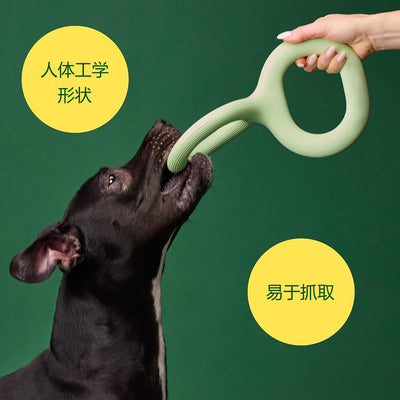 Light green rubber pet bite and pull toy shaped like a figure eight, with a ribbed texture on one end. - Image 19