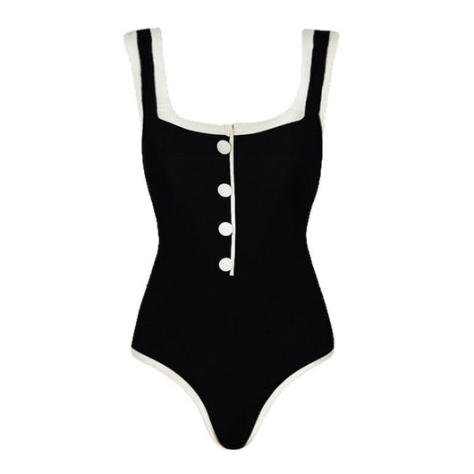 Woman in a white one-piece swimsuit with black trim and decorative buttons, sitting on a boat. - Image 5