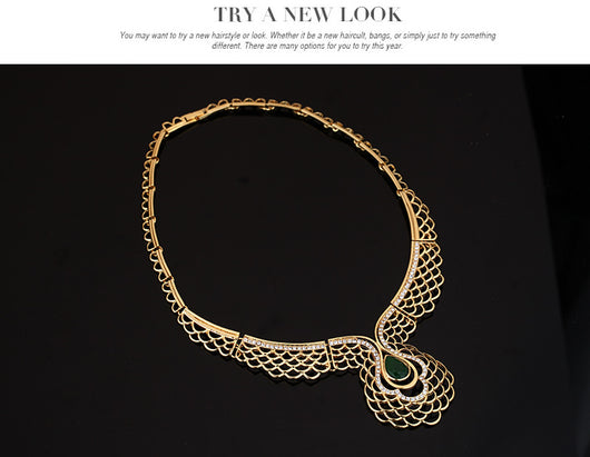 Four-piece gold-tone jewelry set with green teardrop accents and clear rhinestones, including a necklace, bracelet, earrings, and ring. - Image 9