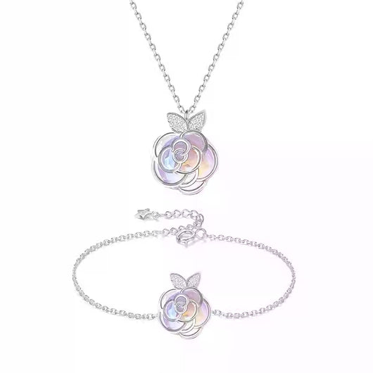 Gold-tone necklace with an iridescent camellia flower pendant and small clear stones on a delicate chain. - Image 10