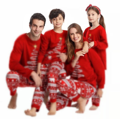 Family of four wearing matching red Christmas pajamas with a Christmas tree graphic and fair isle pattern. - Image 5