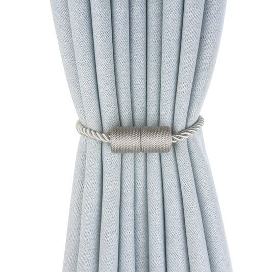 Black cylindrical magnetic curtain tieback holding a light blue pleated curtain, against a clean white background. - Image 2