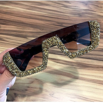 Black square sunglasses with a wavy top frame embellished with brown and clear rhinestones and gradient smoke lenses. - Image 9