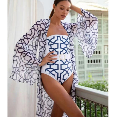 Woman in black and white floral print one-piece swimsuit with matching long-sleeved kimono cover-up and white belt. - Image 15
