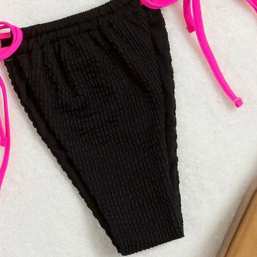 Black textured two-piece bikini with hot pink lace-up ties. Features a halter triangle top and high-cut bottoms. - Image 5