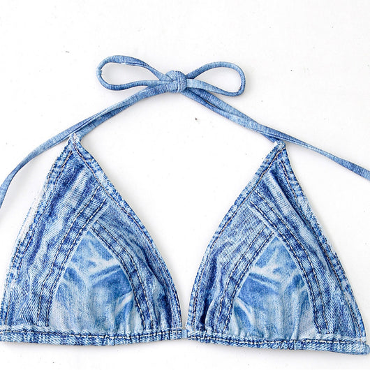 Women's light blue denim print two-piece bikini swimsuit with a halter neck top and tie-side bottoms, styled with a straw hat and sunglasses. - Image 3