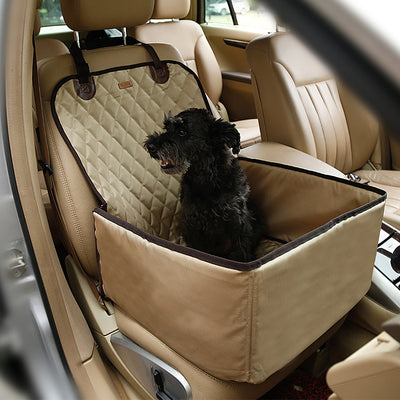 Black quilted waterproof pet car seat for front passenger seat, with a small black dog sitting inside. - Image 9