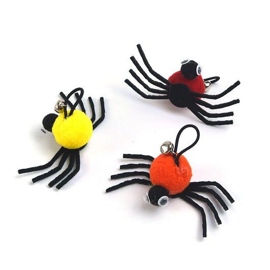 Orange and black plush spider cat toy with googly eyes and a silver bell on a white background. - Image 8