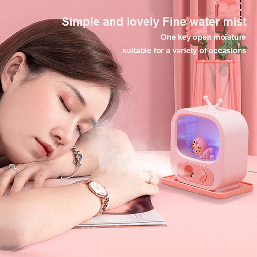 Pink TV-shaped desktop humidifier with a cute pink caterpillar figure inside, featuring a mist outlet and control knob. - Image 3