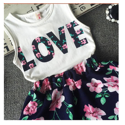 Conjunto de Dos Piezas para Niña: Chaleco Floral con Alfabeto y Falda Corta - Image 6