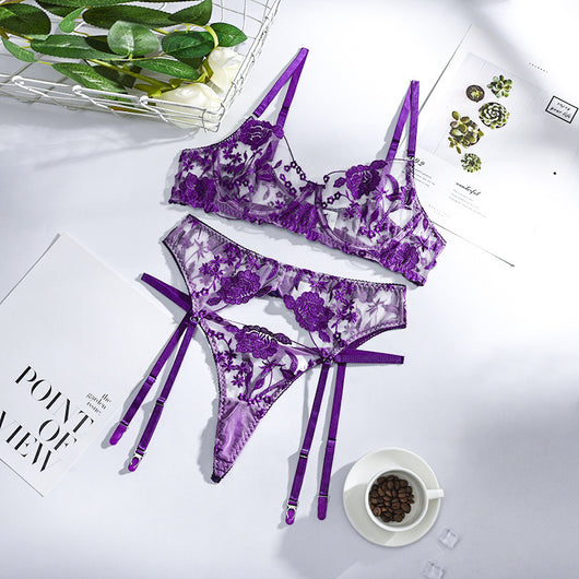 Purple embroidered lace three-piece lingerie set with underwire bra, thong, and garter belt on a white surface. - Image 4
