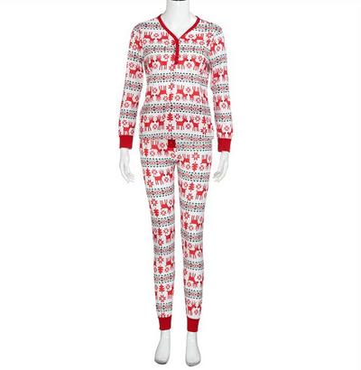 Family of four and a dog wearing matching long-sleeved Christmas pajamas with red reindeer and green snowflake print. - Image 8