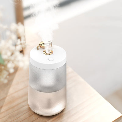 Cute cat-themed USB desktop humidifier with a pink top and base, frosted clear body, and gold cat ear accent. - Image 3