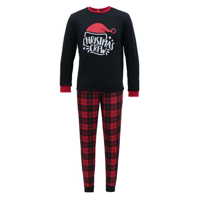 Family of four wearing matching red and black plaid Christmas pajamas with "Christmas CREW" graphic, children in Santa hats. - Image 5