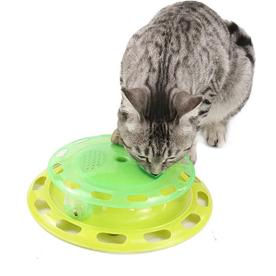 Green and yellow two-tier interactive cat toy turntable with a bell ball in the track and kibble in the top compartment. - Image 4