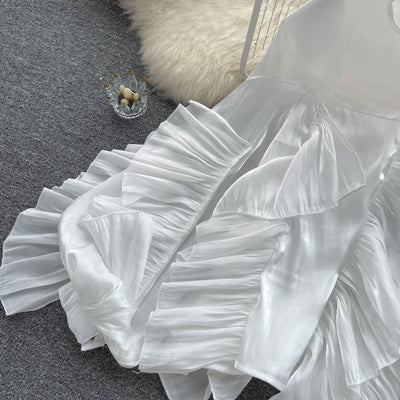 Blusa Larga de Gasa con Volantes Irregulares y Mangas Largas - Image 11