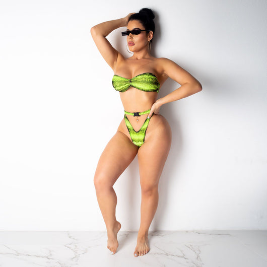 Woman in a purple and pink snakeskin print three-piece swimsuit with an off-shoulder crop top and high-waisted bottoms. - Image 11