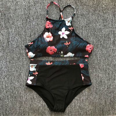 Black high-neck halter bikini top and high-waisted bottoms with pink and white floral leaf print. - Image 8