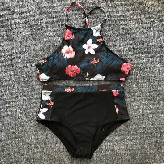 Black high-neck halter bikini top and high-waisted bottoms with pink and white floral leaf print. - Image 8