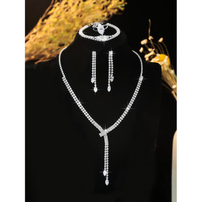 Sparkling rhinestone necklace, dangle earrings, and bracelet set on a black display, perfect for formal events. - Image 6