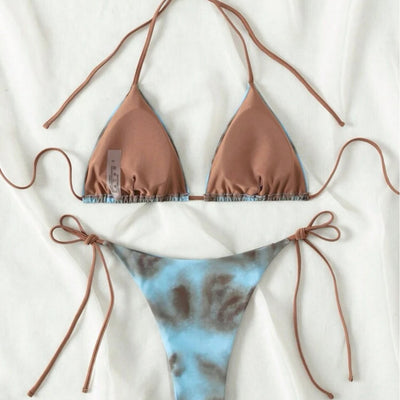 Women's two-piece bikini swimsuit with blue and neon yellow tie-dye pattern, featuring a triangle top and tie-side bottom. - Image 2