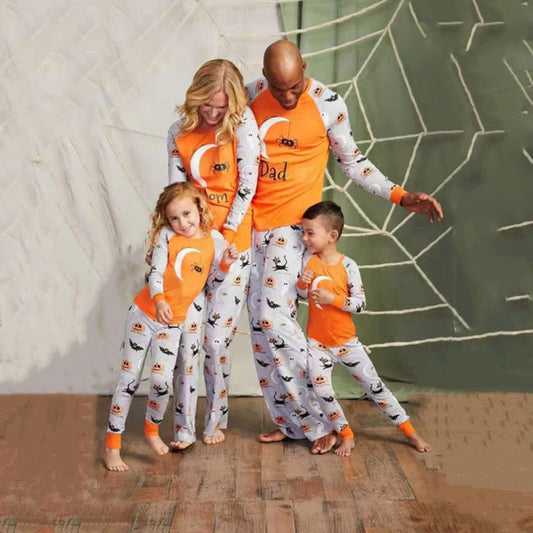 Matching family Halloween pajamas with orange and grey long-sleeve shirts and pants, featuring ghosts, pumpkins, and bats.