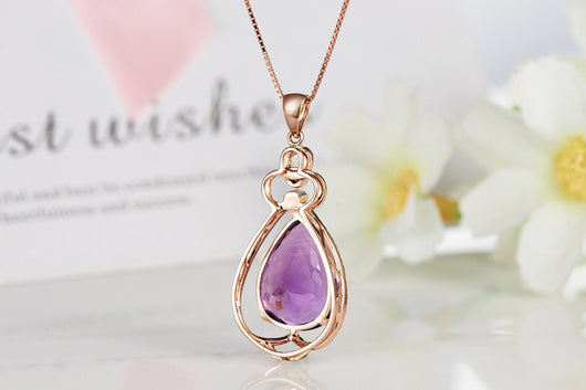 Rose gold necklace with a teardrop purple gemstone pendant and matching dangle earrings. - Image 22