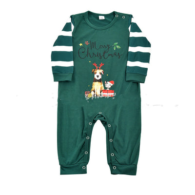 Woman in a Christmas pajama set with a white top, green sleeves, dinosaur graphic, and green fair isle pants. - Image 8