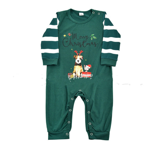 Woman in a Christmas pajama set with a white top, green sleeves, dinosaur graphic, and green fair isle pants. - Image 8