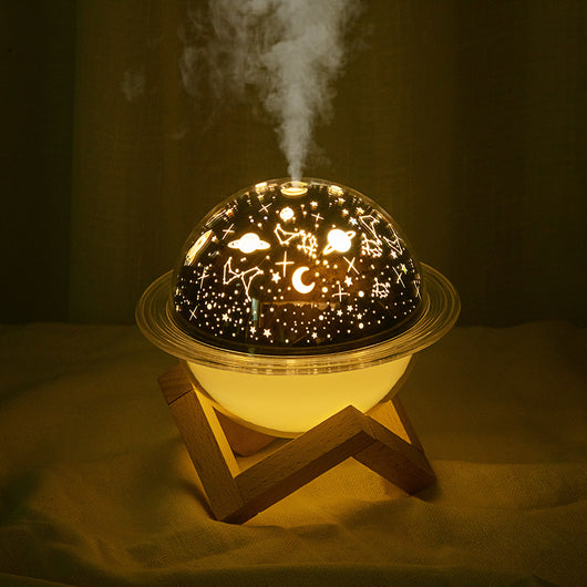 Christmas style planet light air purifier and humidifier, glowing green with festive projections on a wooden stand. - Image 7