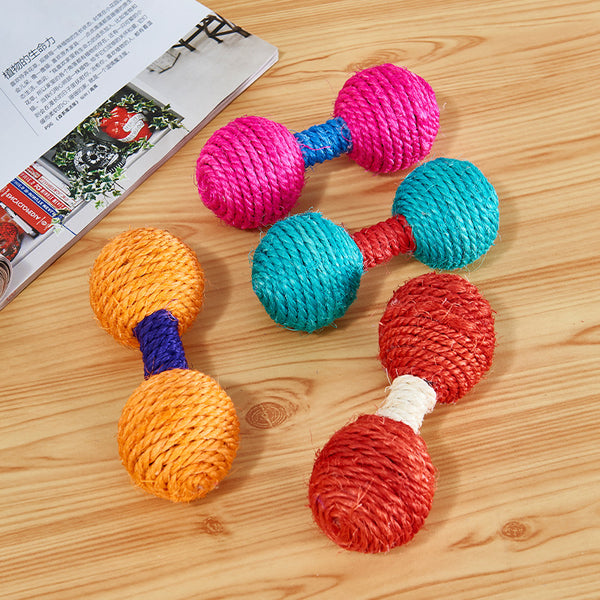 Five colorful sisal dumbbell-shaped cat toys in blue, pink, teal, orange, and red on a light wood surface.