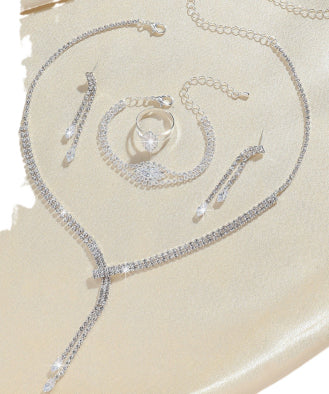 Sparkling rhinestone necklace, dangle earrings, and bracelet set on a black display, perfect for formal events. - Image 11