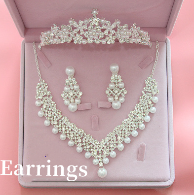 Three-piece bridal jewelry set with a rhinestone and pearl tiara, matching necklace, and chandelier earrings in a pink box.