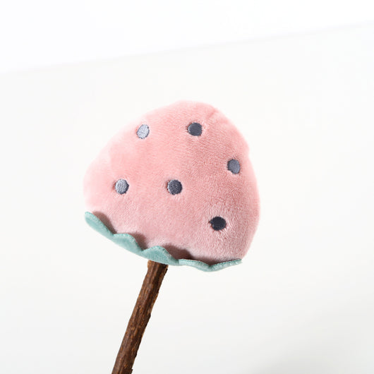Plush carrot-shaped cat molar stick with green leaves on a natural wood stick, designed for pet play. - Image 9