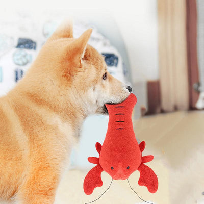 Purple plush eggplant pet toy with a green stem and an embroidered happy face, designed for dogs and cats. - Image 2