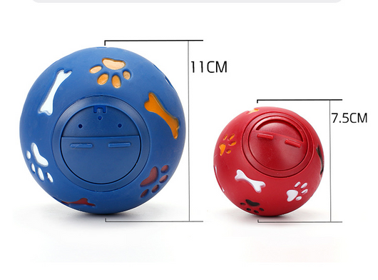 Red rubber pet puzzle ball with white, blue, and orange paw print and bone cutouts, featuring a treat dispenser opening. - Image 7